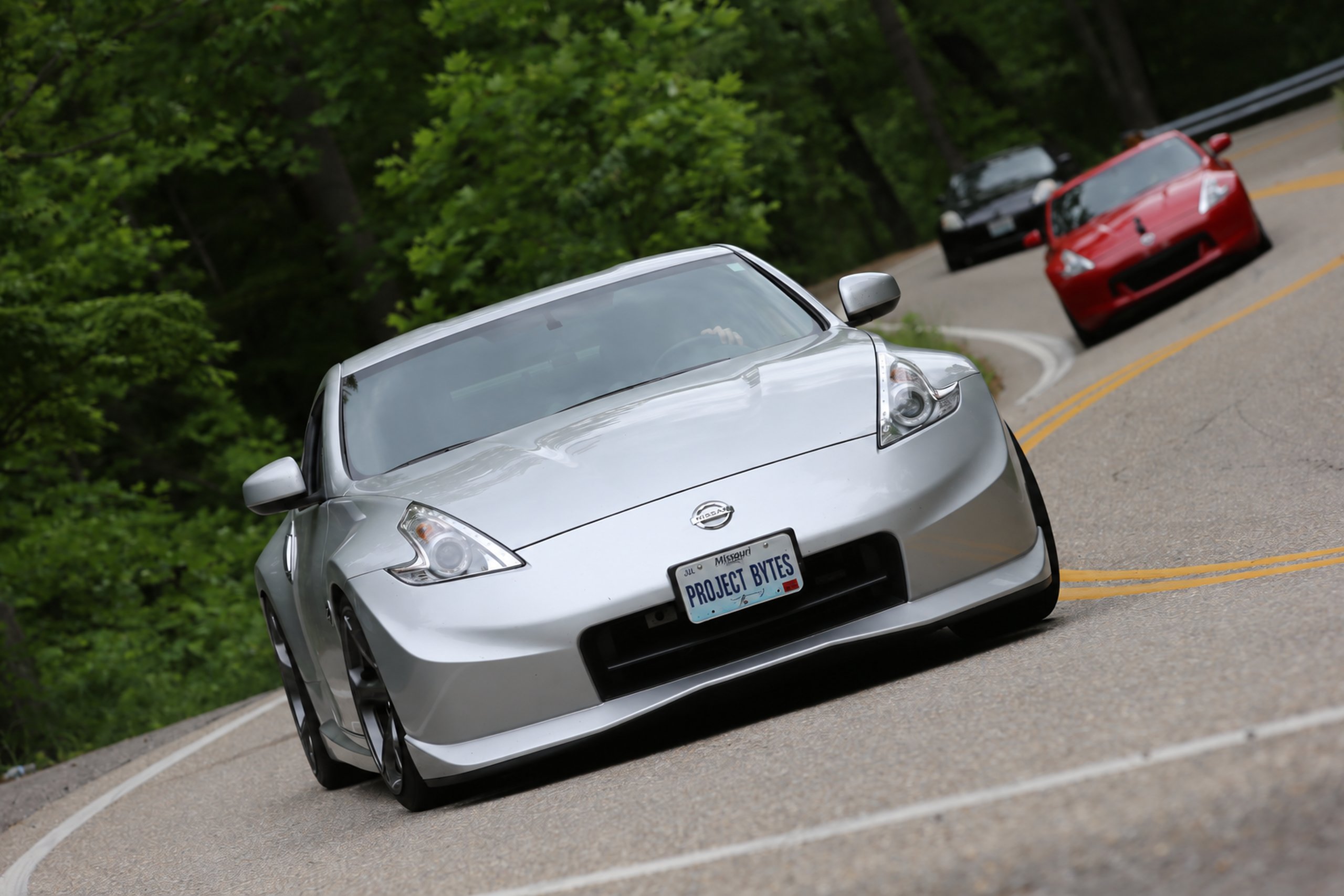 Silver Nissan 370Z on a curvy mountain road