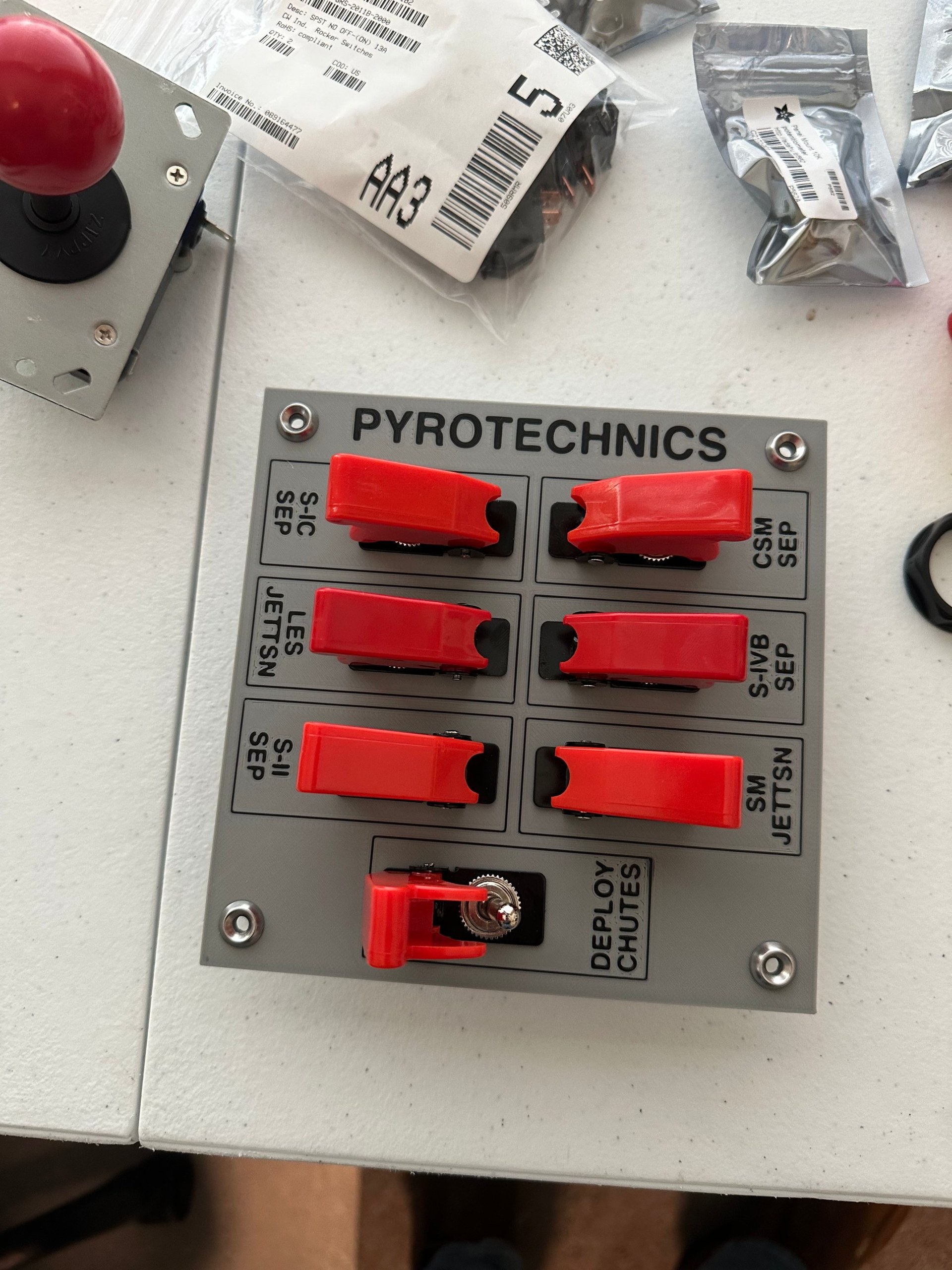 3D printed Pyrotechnics panel with seven red missile switch covers