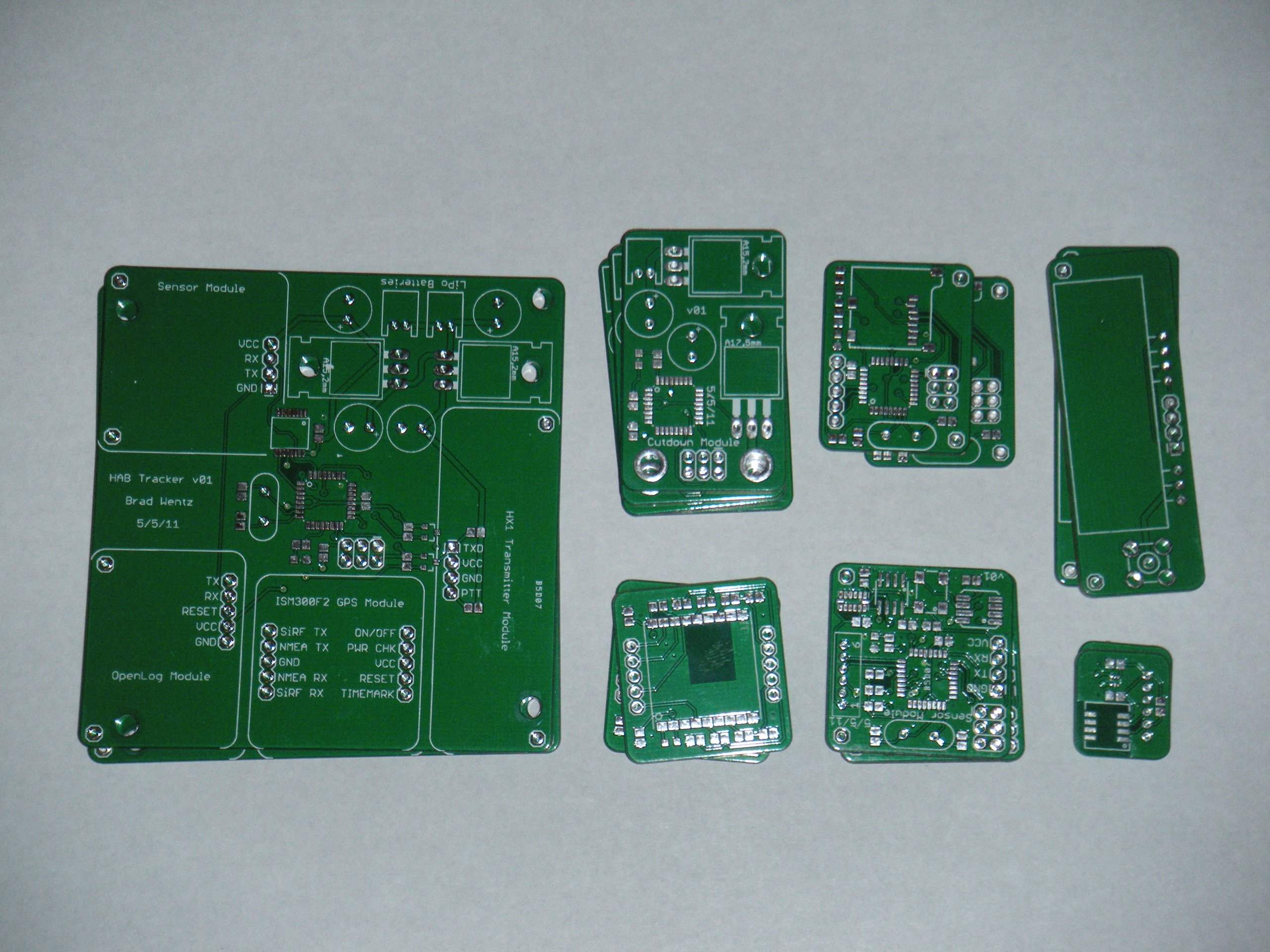 Bare green circuit boards for the high altitude balloon tracker: main board, cutdown, GPS, sensor and transmitter modules