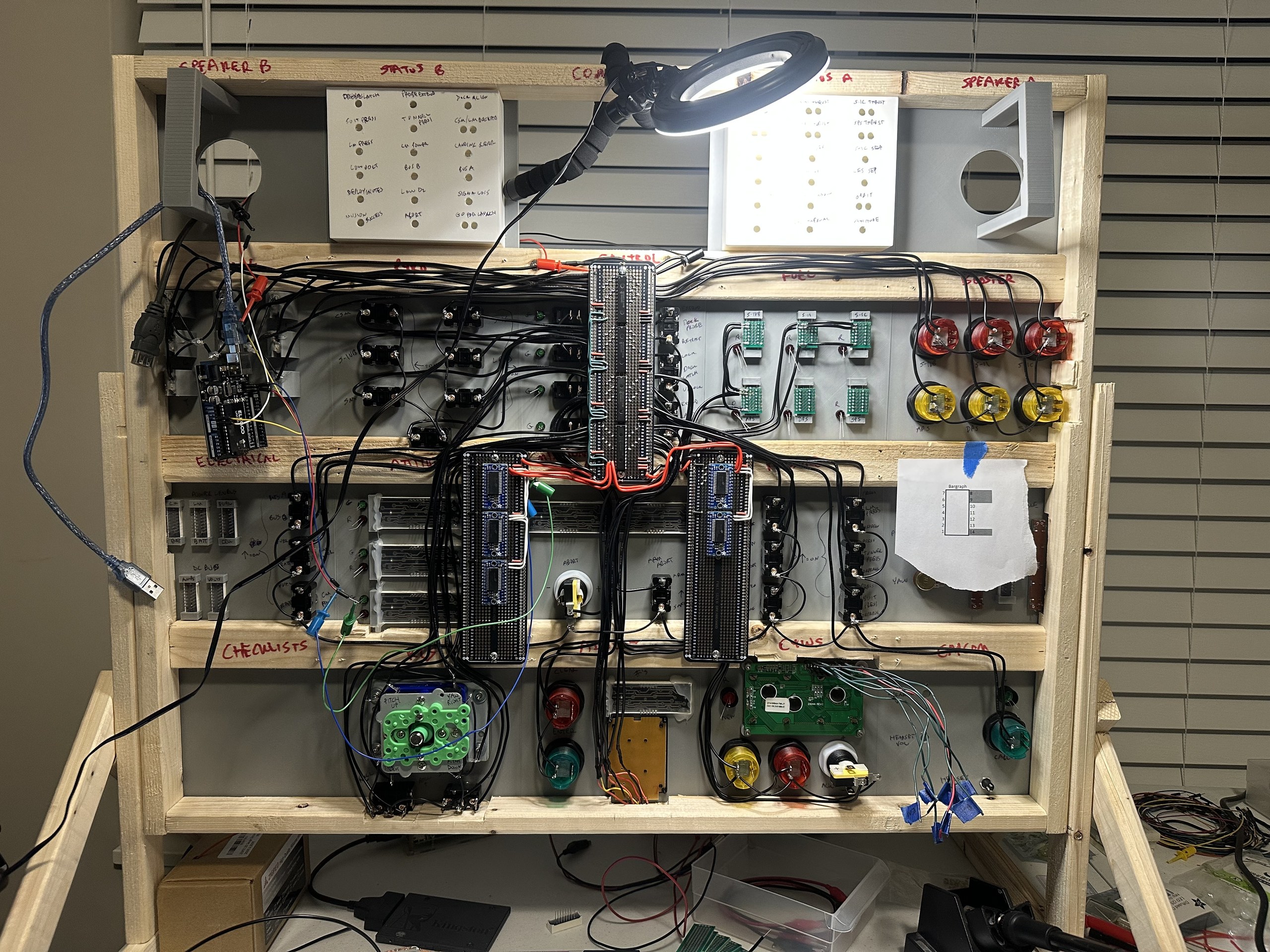 Apollo simulator panel partway through wiring, with an Arduino and ring light